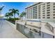 Elegant outdoor kitchen featuring a premium built-in grill, concrete countertops and steel appliances at 301 1St S St # 3004, St Petersburg, FL 33701