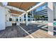 Expansive outdoor living area with sleek tile flooring, covered lounge space, and stunning views of the pool at 301 1St S St # 3004, St Petersburg, FL 33701