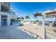 Beautifully designed outdoor patio featuring tiled flooring, palm trees and covered seating areas with ocean views at 301 1St S St # 3004, St Petersburg, FL 33701