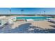 Rooftop pool featuring in-water lounge seating, a water feature, and views of the marina at 301 1St S St # 3004, St Petersburg, FL 33701