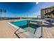 Rooftop pool featuring in-water stairs, a water feature, and views of the marina at 301 1St S St # 3004, St Petersburg, FL 33701