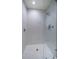 Modern shower with light grey tile walls, glass enclosure, and rainfall shower head at 301 1St S St # 3004, St Petersburg, FL 33701