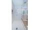 Modern shower with tile surround, rainfall shower head, and glass enclosure at 301 1St S St # 3004, St Petersburg, FL 33701