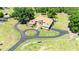 Expansive property with a large home, circular driveway, and lush green landscape at 30723 Reed Rd, Dade City, FL 33523
