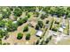 Lush property featuring a spacious home with a pool, sizable workshop, and a circular driveway at 30723 Reed Rd, Dade City, FL 33523