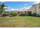 Lush backyard with a screened-in lanai and mature landscaping at 30723 Reed Rd, Dade City, FL 33523