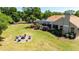 Beautiful backyard with patio, pool, and firepit, perfect for outdoor living and entertaining at 30723 Reed Rd, Dade City, FL 33523