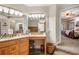 Bathroom vanity with make-up station and access to the main bedroom at 30723 Reed Rd, Dade City, FL 33523