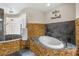 Beautiful bathroom with soaking tub, glass block shower, and modern fixtures at 30723 Reed Rd, Dade City, FL 33523