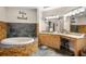 Beautiful bathroom featuring a relaxing soaking tub and dual vanities at 30723 Reed Rd, Dade City, FL 33523