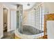 This bathroom boasts a glass block shower and modern fixtures at 30723 Reed Rd, Dade City, FL 33523