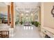Grand foyer featuring high ceilings, elegant columns, and ample natural light illuminating the beautiful space at 30723 Reed Rd, Dade City, FL 33523