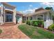 Elegant front entrance with brick walkway, well-kept lawn, and a distinguished double door at 30723 Reed Rd, Dade City, FL 33523