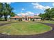 Attractive single-story home with a well-manicured lawn and circular driveway, providing curb appeal at 30723 Reed Rd, Dade City, FL 33523