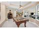 Spacious game room with a beautiful pool table, bar area, and lots of natural light at 30723 Reed Rd, Dade City, FL 33523