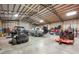 Large garage featuring boat, ATV, tractor, and plenty of space at 30723 Reed Rd, Dade City, FL 33523