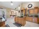Open kitchen with granite countertops, stainless steel appliances, and an open floor plan at 30723 Reed Rd, Dade City, FL 33523