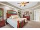 Large main bedroom features plush carpet, tray ceilings, and plenty of natural light at 30723 Reed Rd, Dade City, FL 33523