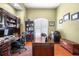 Lovely home office with custom desk, shelving, and hardwood floors at 30723 Reed Rd, Dade City, FL 33523