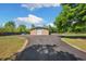 Large outbuilding/workshop with paved driveway on a sunny day at 30723 Reed Rd, Dade City, FL 33523