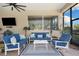 Comfortable covered patio featuring stylish seating, a ceiling fan, and a serene outdoor ambiance at 30723 Reed Rd, Dade City, FL 33523