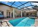 Expansive screened-in pool area with a covered patio and ample space for entertaining at 30723 Reed Rd, Dade City, FL 33523