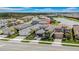 An aerial view of a well-kept single-Gathering home with lush landscaping in a friendly neighborhood at 3096 Great Banyan Way, Wesley Chapel, FL 33543