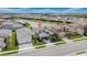 Aerial view of a well-maintained single-Gathering home with a manicured lawn and a two-car garage at 3096 Great Banyan Way, Wesley Chapel, FL 33543
