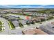 Wide aerial shot showcases a vibrant community with lakes, homes, and nearby amenities at 3096 Great Banyan Way, Wesley Chapel, FL 33543