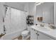 Neutral bathroom featuring a shower-tub combination, a white sink vanity and bronze-toned hardware at 3096 Great Banyan Way, Wesley Chapel, FL 33543