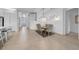 Bright dining area features modern lighting, seating for six and an open floor plan at 3096 Great Banyan Way, Wesley Chapel, FL 33543