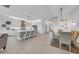 Open-concept kitchen with a large island, stainless appliances and adjacent dining area at 3096 Great Banyan Way, Wesley Chapel, FL 33543