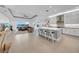 Spacious kitchen with a large island, seating, and open to the living area at 3096 Great Banyan Way, Wesley Chapel, FL 33543