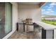 An outdoor kitchen boasts a built-in grill and sink, perfect for al fresco dining and entertaining in a backyard setting at 3096 Great Banyan Way, Wesley Chapel, FL 33543