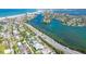 Expansive aerial view of St. Pete Beach featuring beachfront homes and a clear intercoastal waterway at 3210 E Maritana Dr, St Pete Beach, FL 33706