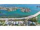 Breathtaking aerial showcases waterfront homes, a scenic bridge, and the intercoastal waterway in St. Pete Beach, Florida at 3210 E Maritana Dr, St Pete Beach, FL 33706