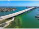 Aerial view of a bridge and intercoastal waterway near waterfront homes in St. Pete Beach, Florida at 3210 E Maritana Dr, St Pete Beach, FL 33706