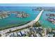 Stunning aerial view of waterfront homes, a bridge, and the intercoastal in St. Pete Beach, Florida at 3210 E Maritana Dr, St Pete Beach, FL 33706