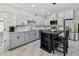 Beautiful kitchen with stainless steel appliances, marble countertops and kitchen island seating at 3210 E Maritana Dr, St Pete Beach, FL 33706