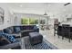 Open concept living space with tropical views from the large windows at 3210 E Maritana Dr, St Pete Beach, FL 33706