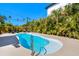Enjoy this sparkling kidney shaped pool surrounded by mature landscaping, perfect for a relaxing afternoon at 3210 E Maritana Dr, St Pete Beach, FL 33706