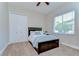 This bedroom features a large bed, closet, carpet and a window for natural light at 3212 Sunset Lakes Blvd, Land O Lakes, FL 34638