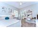 Cozy bedroom with carpet, a desk area, and closet with mirrored doors at 3212 Sunset Lakes Blvd, Land O Lakes, FL 34638