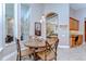 Breakfast nook with wooden table and chairs and lots of natural light from the windows at 3212 Sunset Lakes Blvd, Land O Lakes, FL 34638