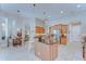 Large kitchen with granite countertops, stainless steel appliances and a breakfast nook with a dining table at 3212 Sunset Lakes Blvd, Land O Lakes, FL 34638