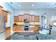 Bright kitchen with lots of storage, stainless steel appliances, granite countertops and tile floors at 3212 Sunset Lakes Blvd, Land O Lakes, FL 34638
