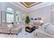 Cozy living room with neutral furnishings, decorative rug, coffee table, and lots of natural light at 3212 Sunset Lakes Blvd, Land O Lakes, FL 34638