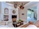 Inviting living room with white built-ins, sliding doors to the lanai and unique ceiling fans at 3212 Sunset Lakes Blvd, Land O Lakes, FL 34638