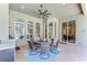 Covered outdoor living space, with seating and unobstructed views through arched windows at 3212 Sunset Lakes Blvd, Land O Lakes, FL 34638