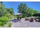 Relax in the backyard under the umbrella, surrounded by lush greenery at 3212 Sunset Lakes Blvd, Land O Lakes, FL 34638